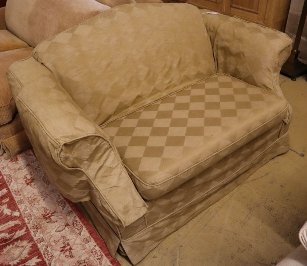 A small upholstered two seater camel back settee with loose pale green cover, length 150cm, depth 88cm, height 84cm